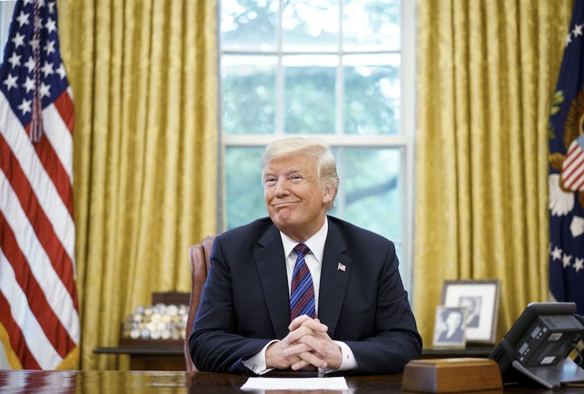 US President Donald Trump smiles during a phone conversation with Mexico's President Enrique Pena Nieto on trade in the Oval Office of the White House in Washington, DC on August 27, 2018. (Mandel Ngan/AFP/Getty Images)