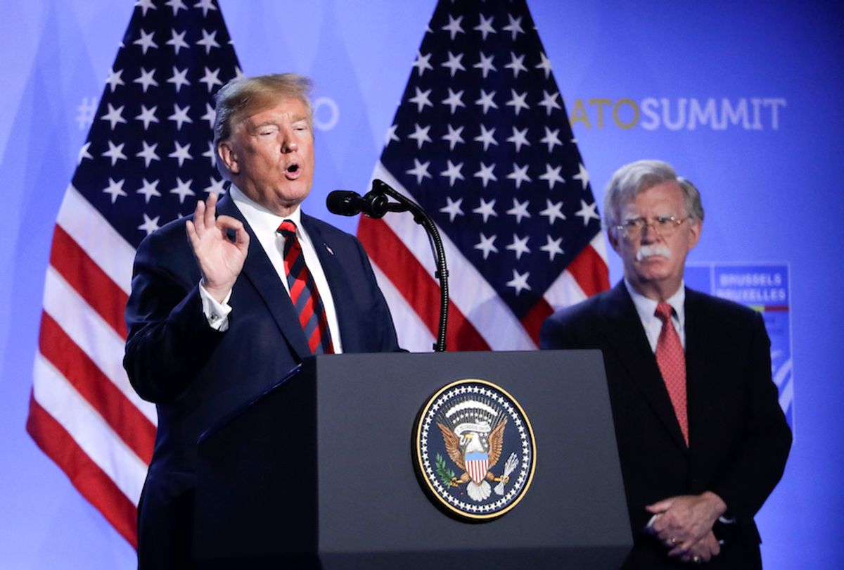 U.S. President Donald Trump, left, is flanked by national security adviser John Bolton, right during a press conference after a summit of heads of state and government at NATO headquarters in Brussels, Belgium, Thursday, July 12, 2018 (AP Photo/Markus Schreiber) (AP Photo/Markus Schreiber)