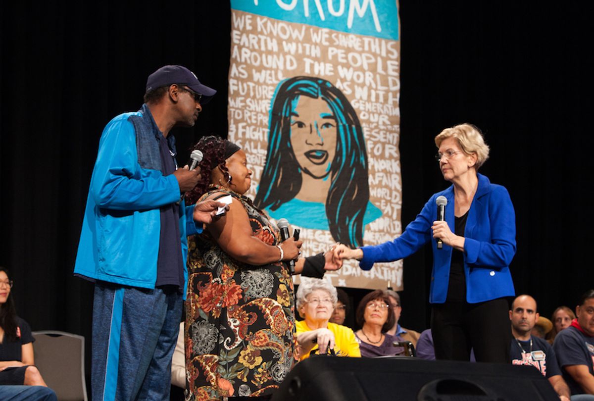 Elizabeth Warren with Chris Robinson (left) and Laural Clinton of the Iowa CCI Action Fund (Karla Conrad)