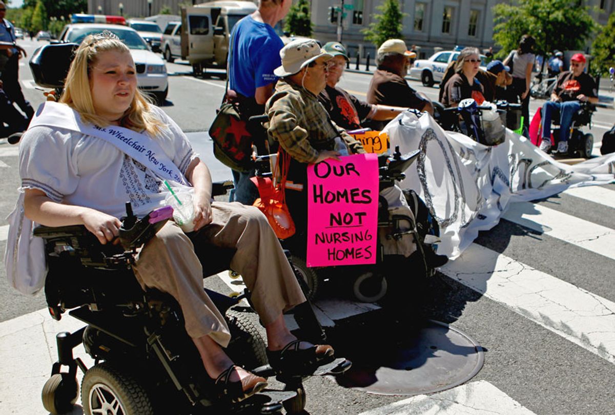 Protestors from ADAPT, a grass-roots community that organizes disability rights activists to engage in nonviolent direct action, block the intersection of 15th Street and Pennsylvania Avenue NW near the White House for nearly four hours September 20, 2010 in Washington, DC. (Chip Somodevilla/Getty Images)