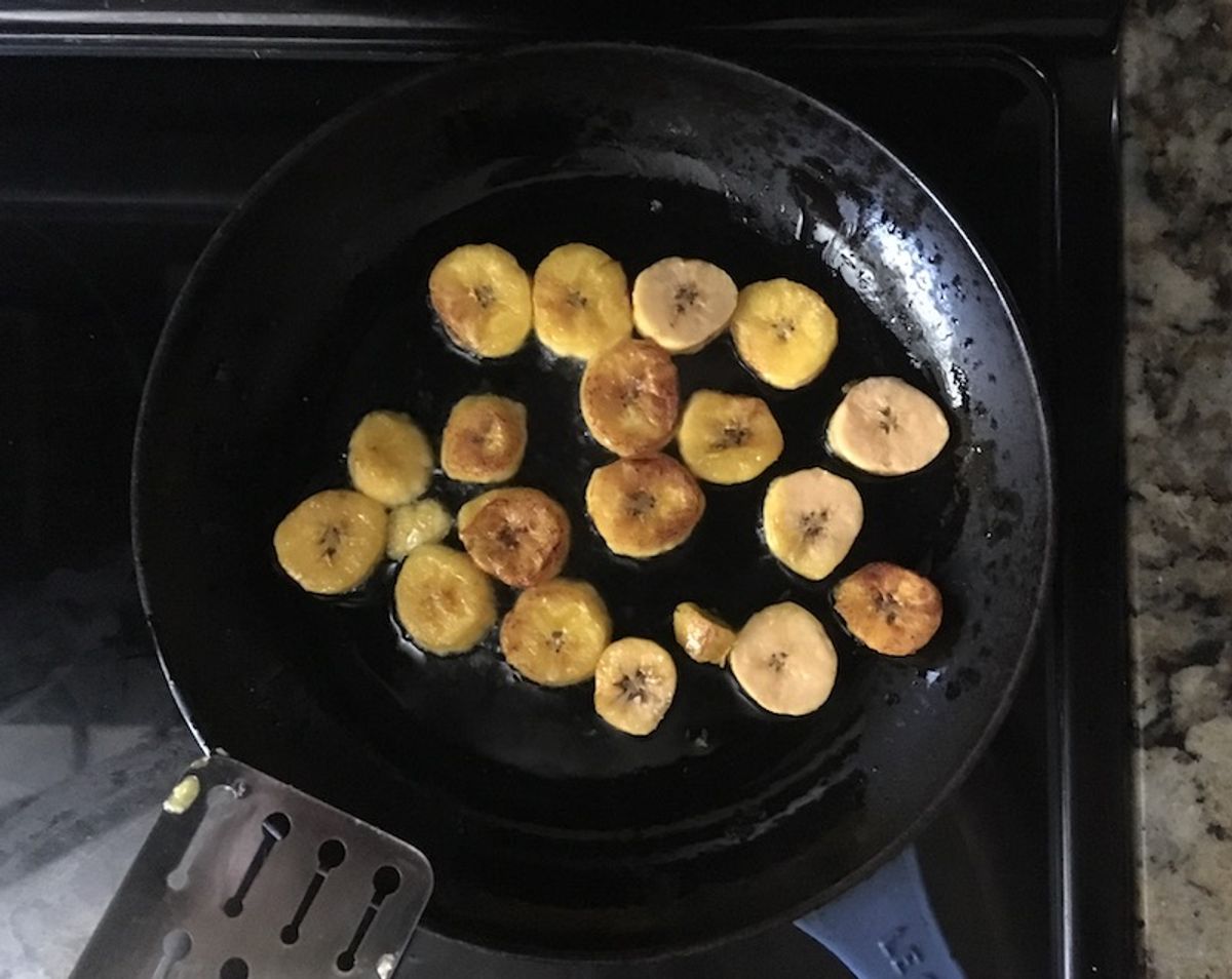 Partially cooked plantains  sautéing. (Salon)