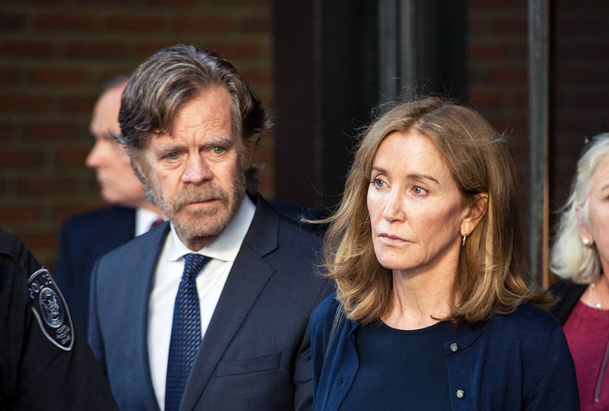 Actress Felicity Huffman, escorted by her husband William H. Macy (L), exits the John Joseph Moakley United States Courthouse in Boston, where she was sentenced by Judge Talwani for her role in the College Admissions scandal on September 13, 2019. - Actress Felicity Huffman gets 14 days jail in US college admissions scandal. (JOSEPH PREZIOSO/AFP/Getty Images)