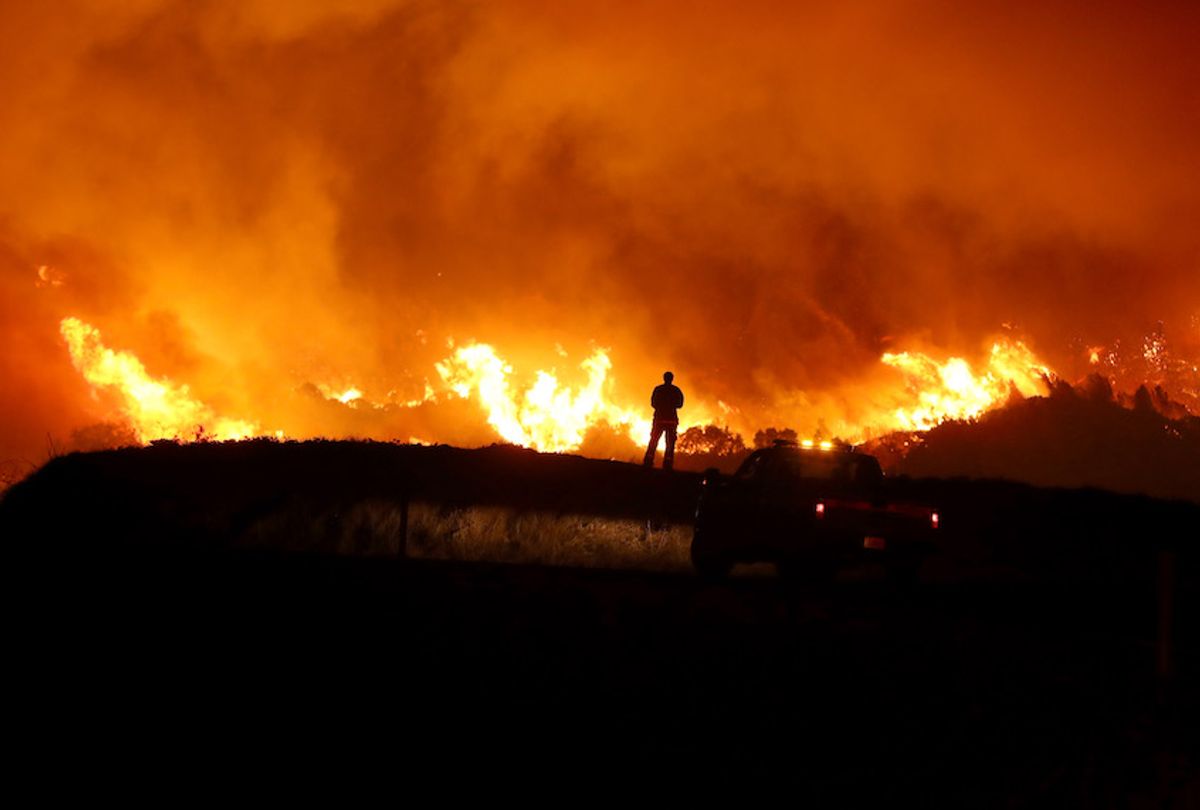 A Cal Fire firefighter monitors the Kincaide Fire as it burns a hillside on October 24, 2019 in Geyserville, California. Fueled by high winds, the Kincaide Fire has burned over 7,000 acres in a matter of hours and has prompted evacuations in the Geyserville area. (Photo by Justin Sullivan/Getty Images) (Justin Sullivan/Getty Images))