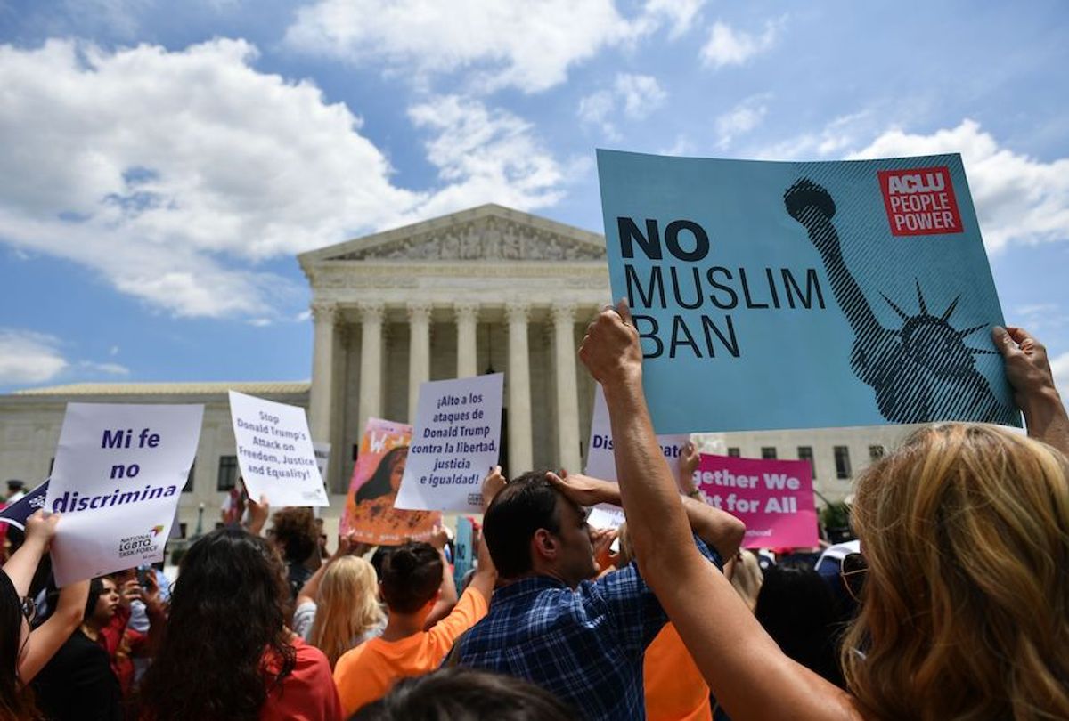 People protest the Muslim travel ban outside of the US Supreme Court in Washington, DC on June 26, 2018.  (Mandel Ngan/AFP via Getty Images)
