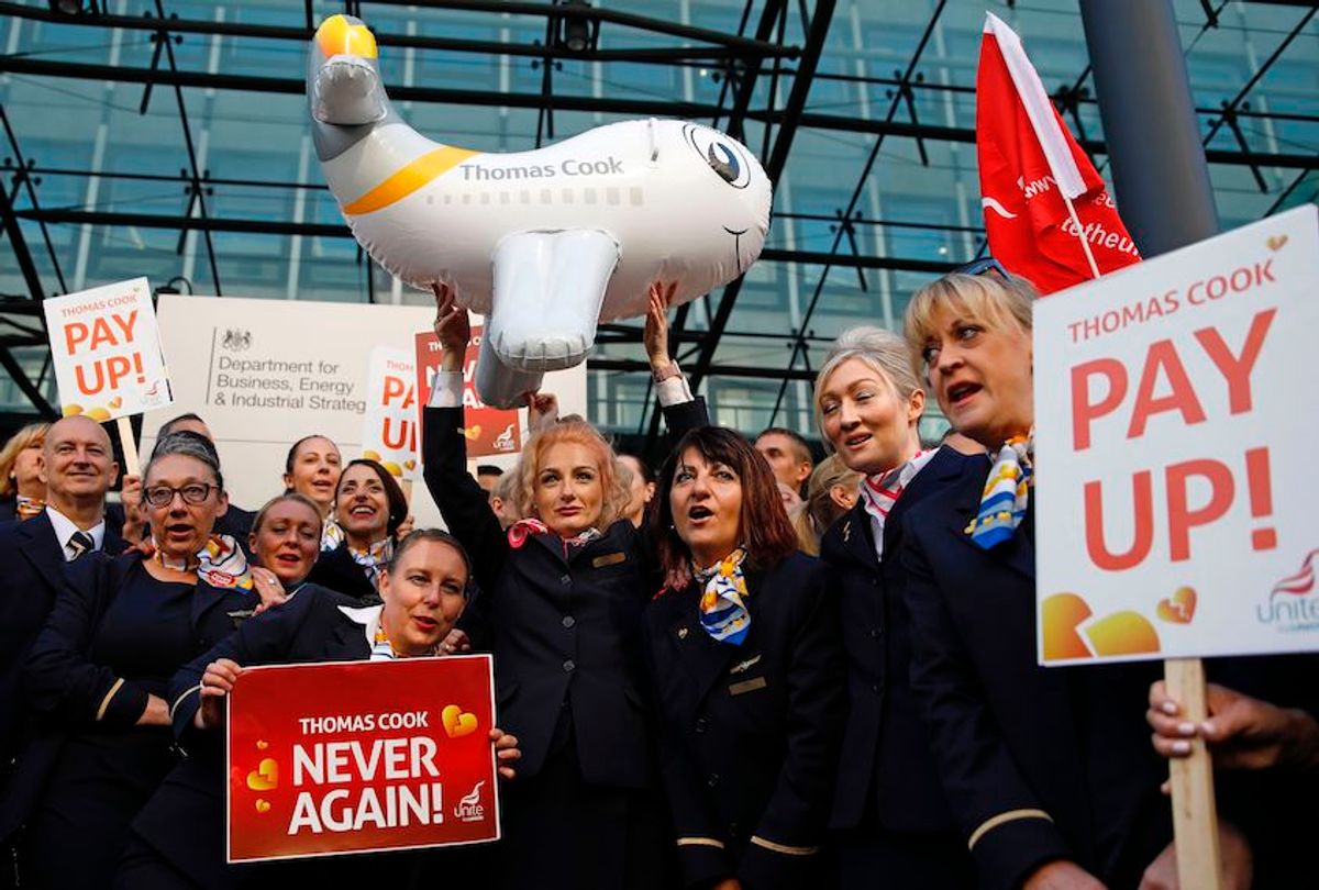 Ex-Thomas Cook employees demonstrate in London on October 2, 2019, after delivering a petition calling on the Government to open a full inquiry into Thomas Cook's collapse and for the company's directors to pay back their bonuses. - British travel firm Thomas Cook collapsed on September 23, leaving hundreds of thousands of  holidaymakers stranded and sparking the UK's biggest repatriation since World War II. (Photo by Tolga AKMEN / AFP) (Photo by TOLGA AKMEN/AFP via Getty Images) (Tolga Akmen/AFP/Getty Images)