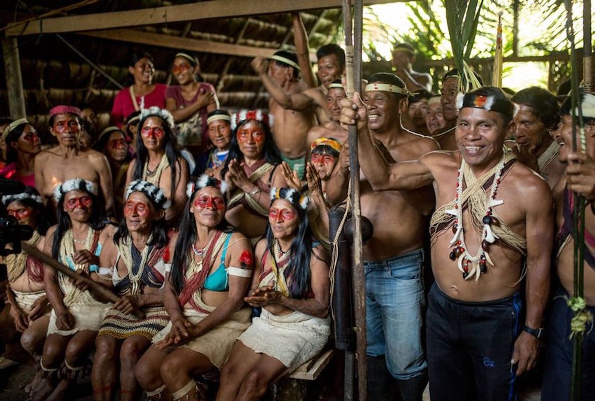 Waorani men and women participate in an assembly in ancestral Waorani territory, Pastaza, Ecuadorian Amazon. (Amazon Frontlines)
