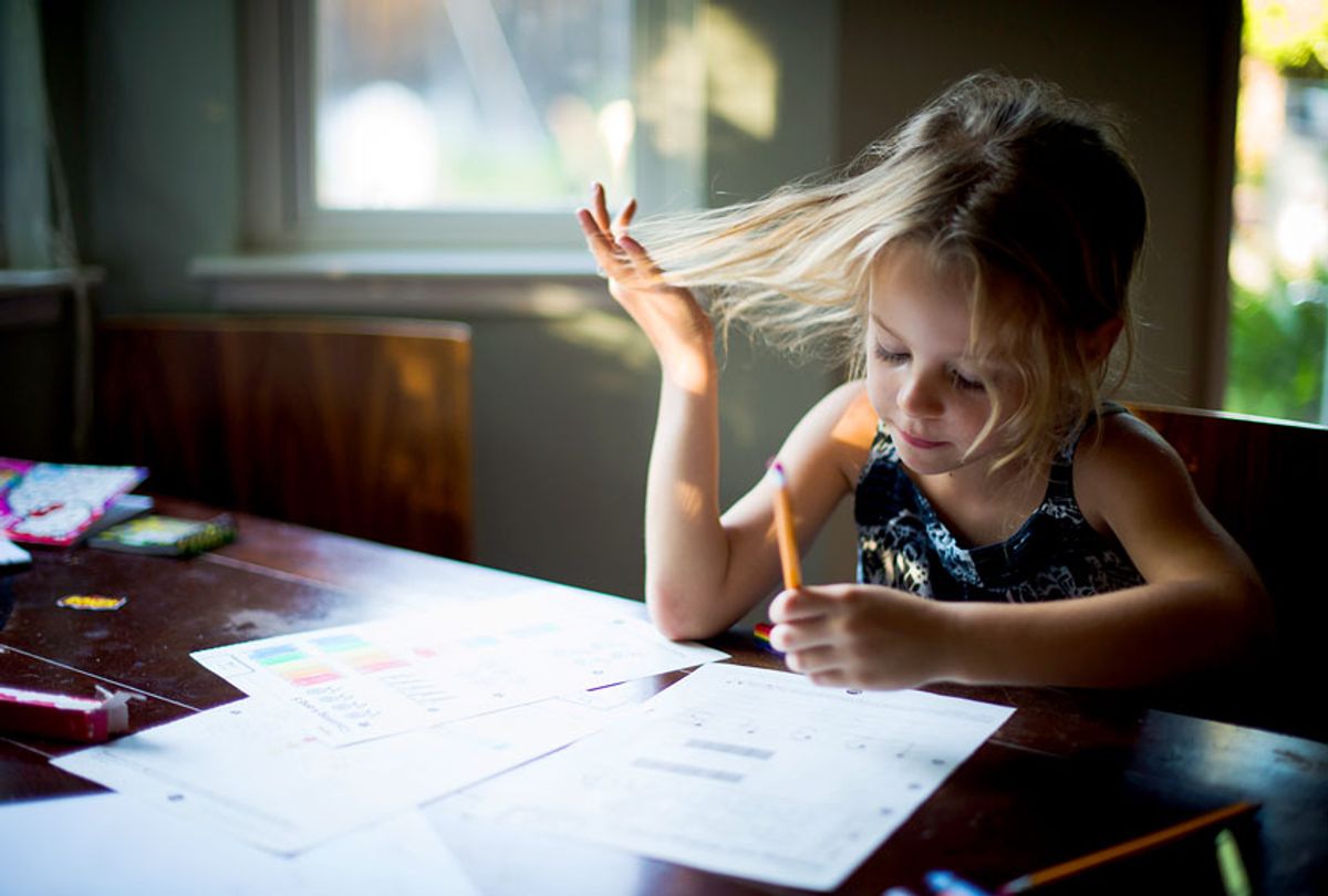 Girl doing homework (Getty Images)