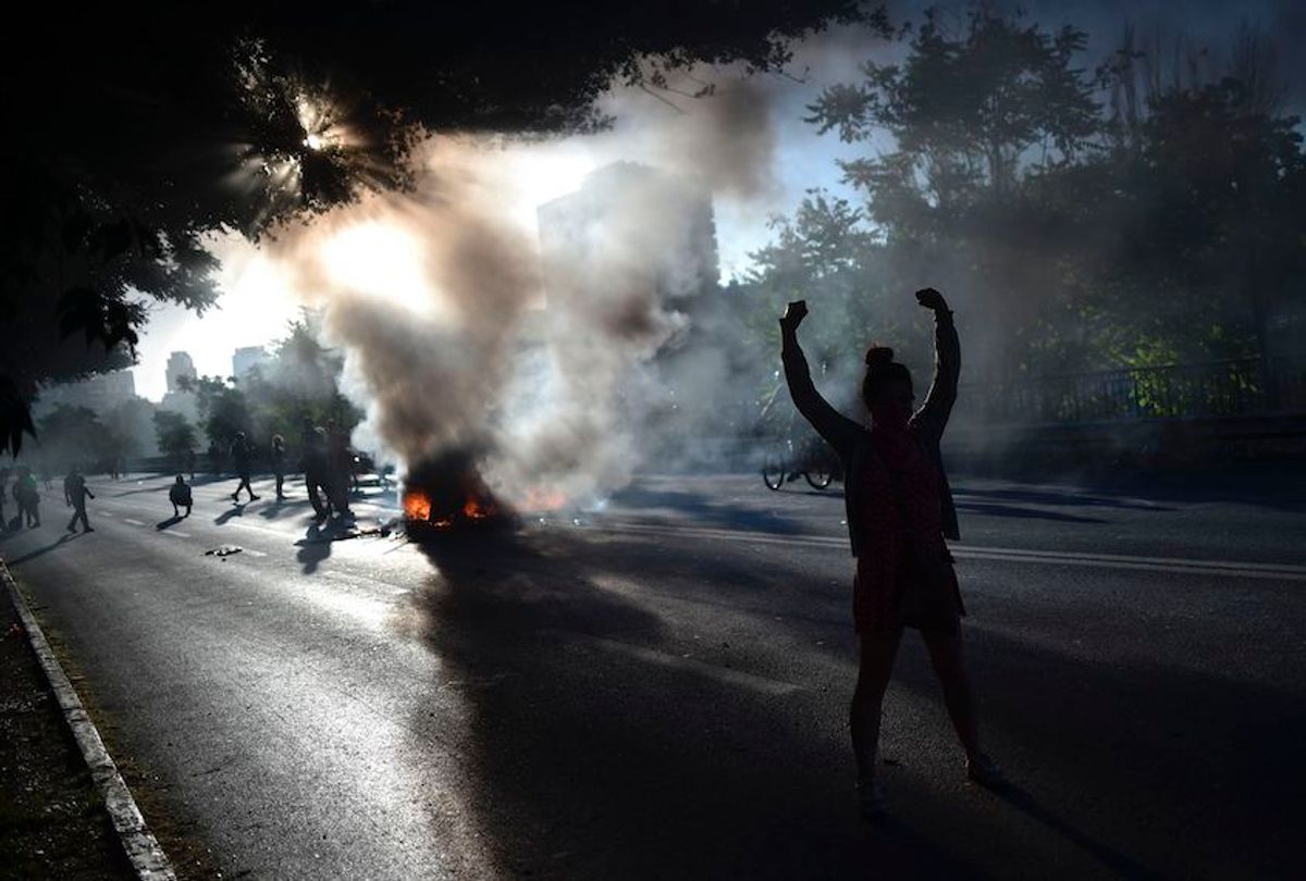 People demonstrate by a bonfire during a protest against the government in Santiago on November 15, 2019.  (Rodrigo Arangua/AFP via Getty Images)