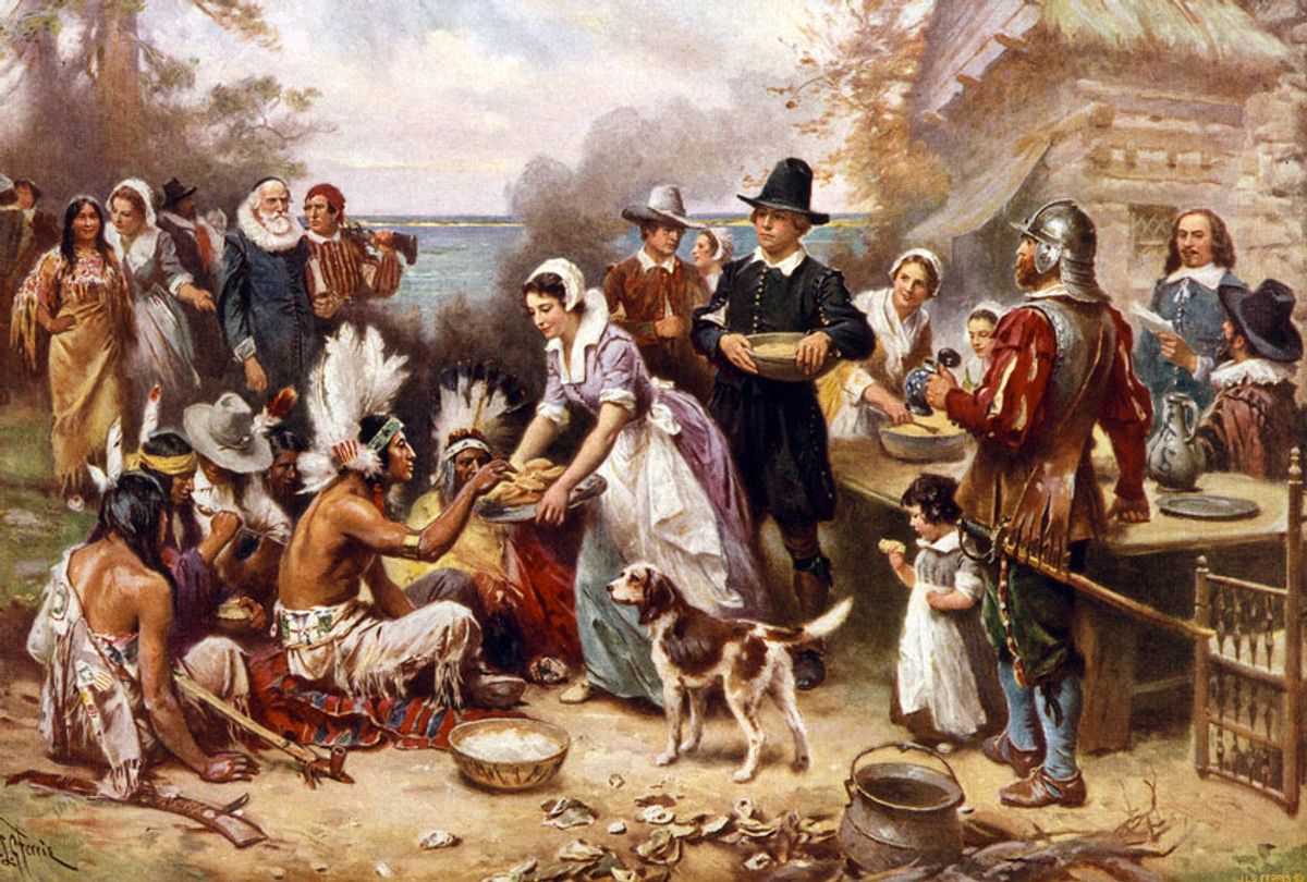 The First Thanksgiving, 1621 by Jean Leon Gerome Ferris, 1863-1930, artist. Published by the Foundation Press, Inc., c1932. Photomechanical print halftone, colour. Pilgrims and Natives gather to share meal. (Photo by:  (Photo12/Universal Images Group via Getty Images)