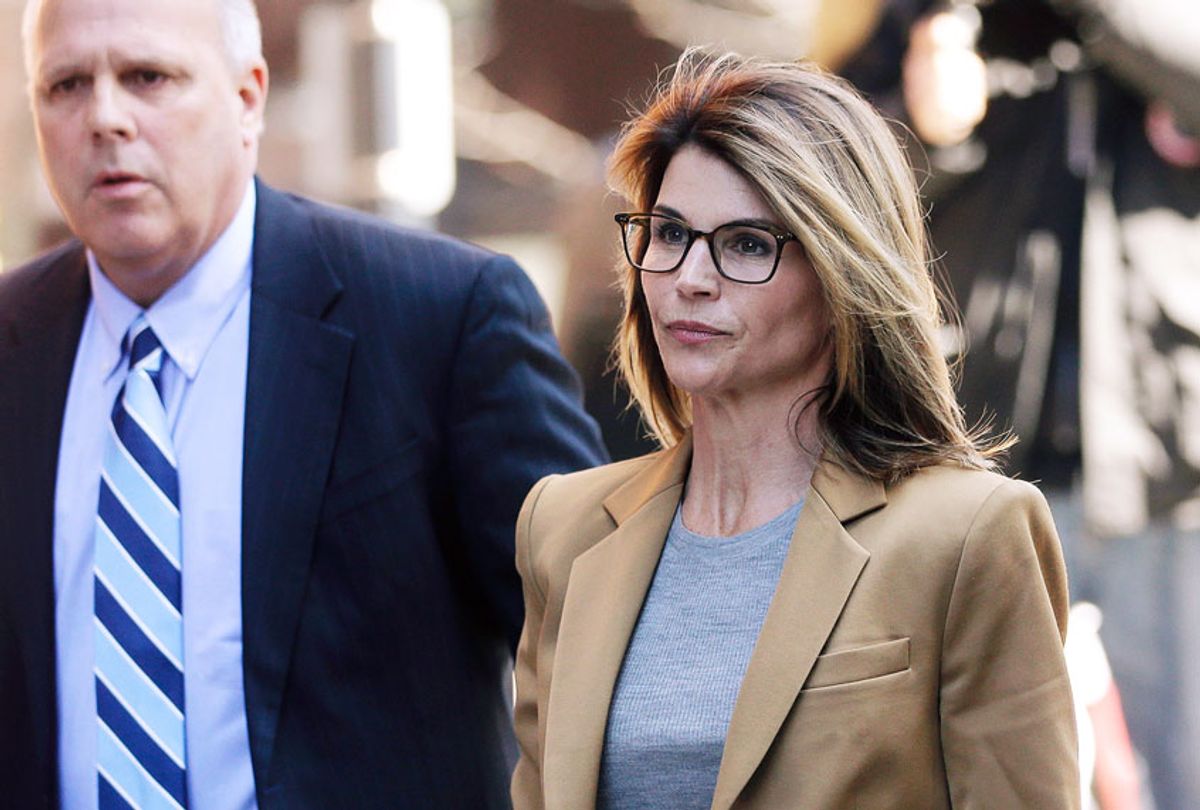 Lori Loughlin arrives at federal court in Boston on Wednesday, April 3, 2019, to face charges in a nationwide college admissions bribery scandal.  (AP Photo/Steven Senne)