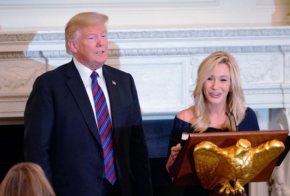 US President Donald Trump is seen with Pastor Paula White at an event honoring Evangelical leadership in the State Dining Room of the White House on August 27, 2018 in Washington, DC.  (MANDEL NGAN/AFP via Getty Images)