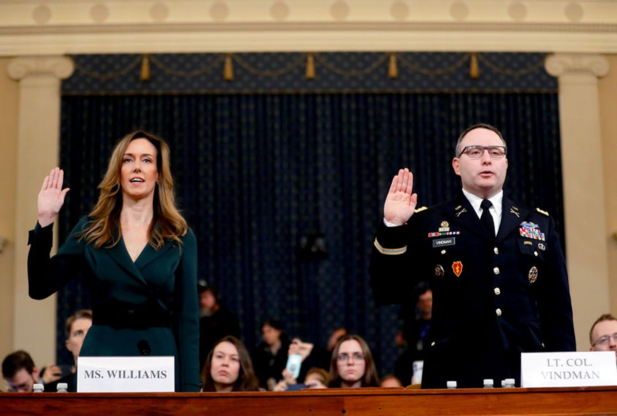 Jennifer Williams, an aide to Vice President Mike Pence, left, and National Security Council aide Lt. Col. Alexander Vindman, are sworn in to testify before the House Intelligence Committee on Capitol Hill in Washington, Tuesday, Nov. 19, 2019, during a public impeachment hearing of President Donald Trump's efforts to tie U.S. aid for Ukraine to investigations of his political opponents.  (AP Photo/Andrew Harnik)