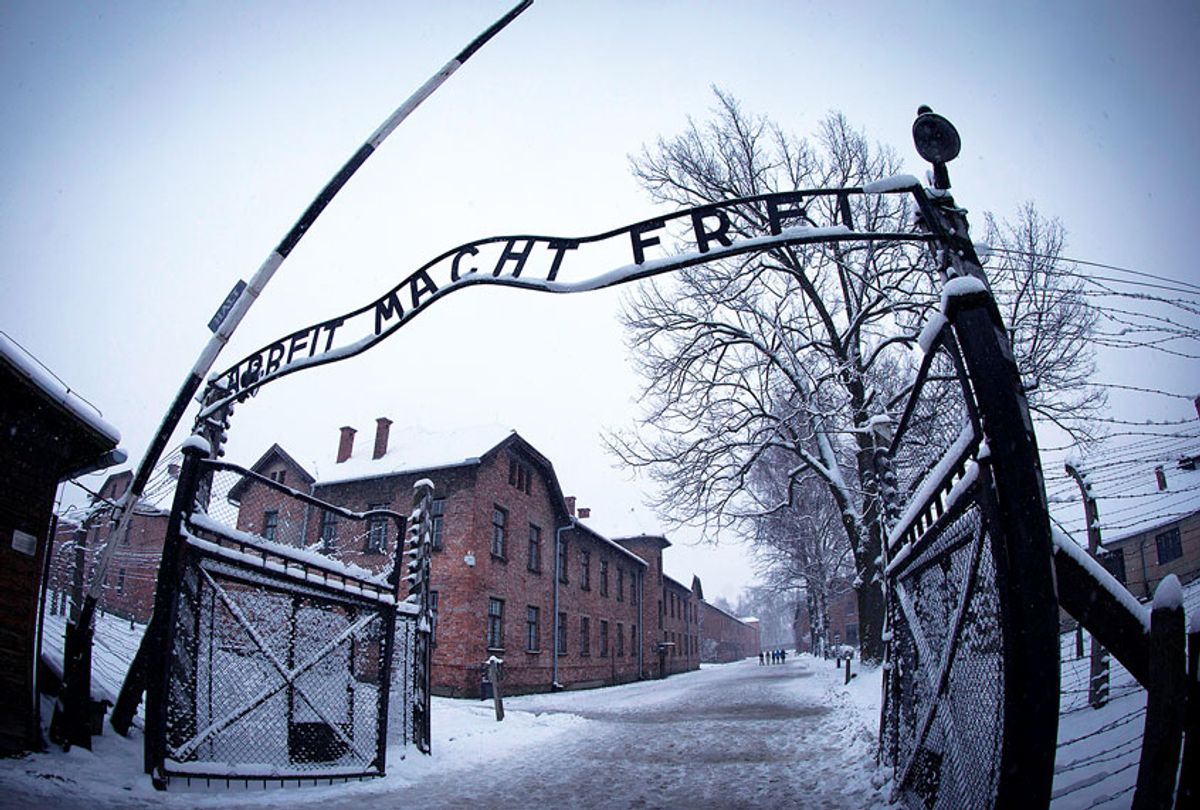 The entrance to the former Nazi concentration camp Auschwitz-Birkenau with the lettering 'Arbeit macht frei' ('Work makes you free') is pictured in Oswiecim, Poland on January 25, 2015, days before the 70th anniversary of the liberation of the camp by Russian forces. (JOEL SAGET/AFP via Getty Images)