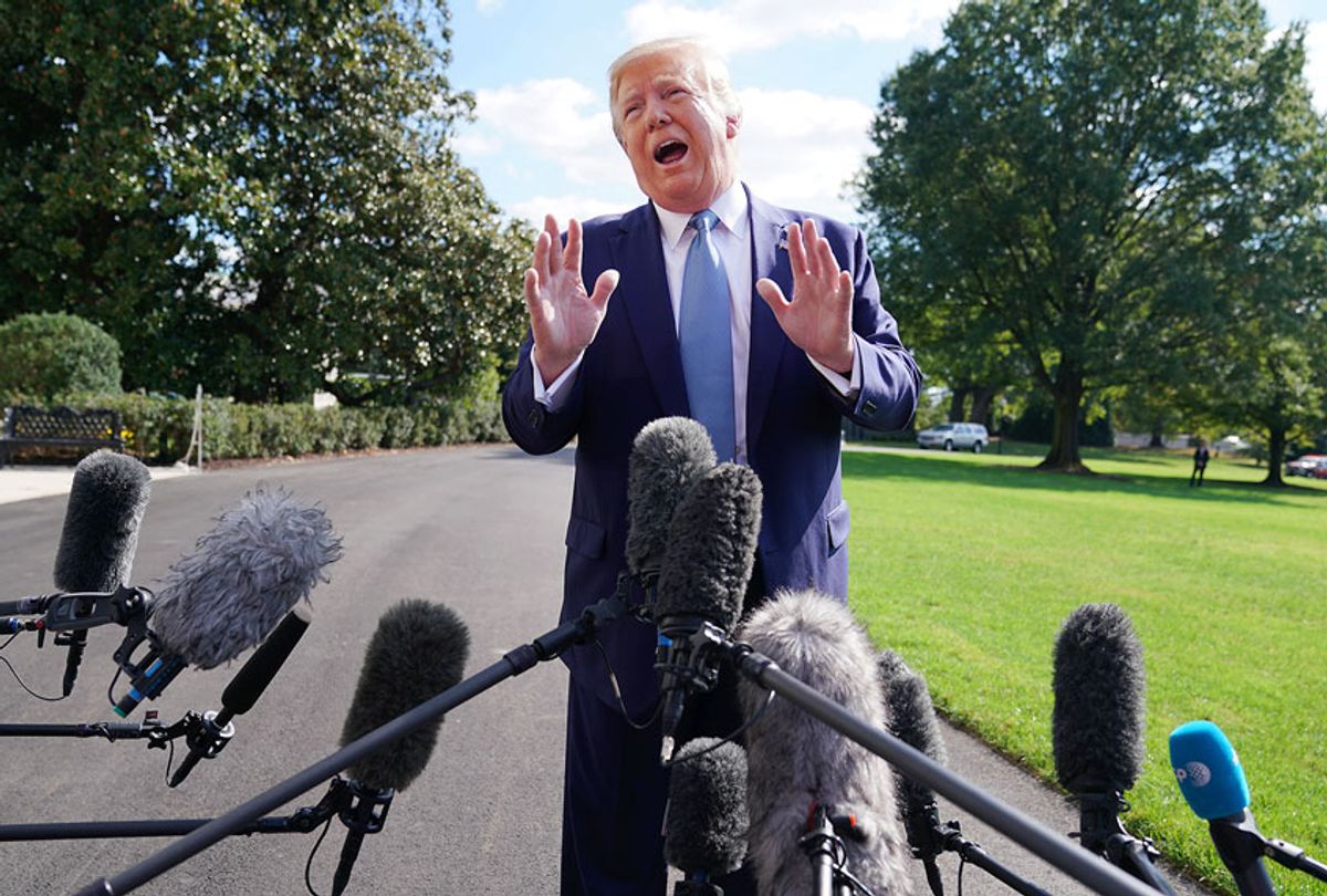 U.S. President Donald Trump talks to journalists on the South Lawn of the White House before boarding Marine One and traveling to Walter Reed National Military Medical Center October 04, 2019 in Washington, DC. According to the White House, Trump will be visiting injured military service members. (Chip Somodevilla/Getty Images)