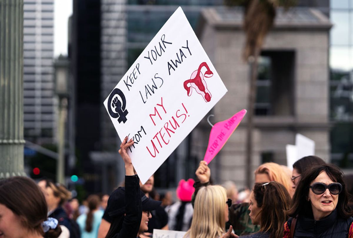 An activist seen holding a placard that says keep your laws away from my uterus during the protest. (Ronen Tivony/SOPA Images/LightRocket via Getty Images)