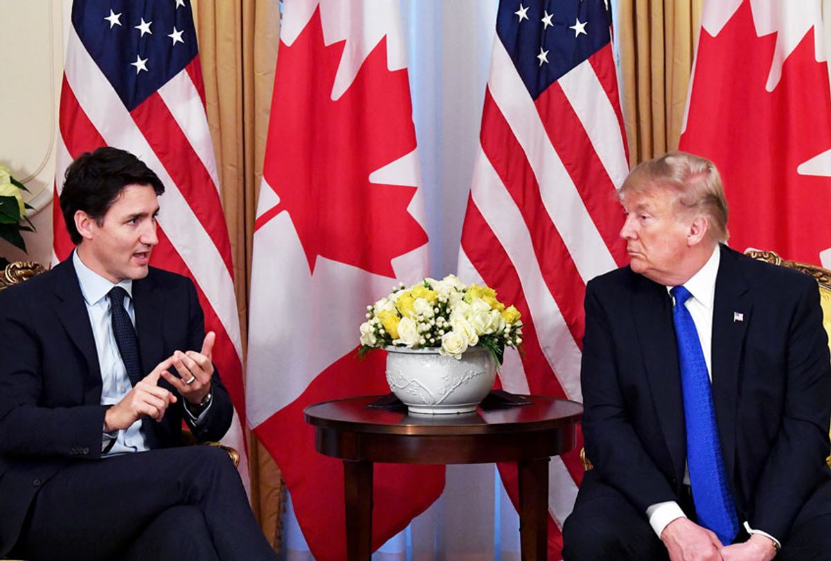 Former President Donald Trump listens to Canada's Prime Minister Justin Trudeau during a meeting at Winfield House, London on December 3, 2019. (NICHOLAS KAMM/AFP via Getty Images)