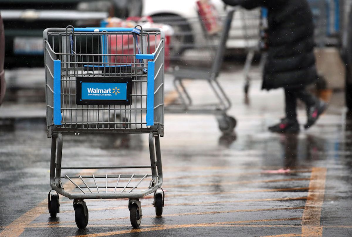 CHICAGO, IL - JANUARY 11:  A shopping cart sits outside of a Walmart store on January 11, 2018 in Chicago, Illinois. Walmart announced today it would use savings from the recently revised tax law to increase their starting wage to $11-per-hour, offer some hourly employees a one-time bonus up to $1000, expand maternity and parental leave benefits and will begin to offer adoption assistance. The company also disclosed today that it would be closing 63 of its Sam's Club stores across the US, costing thousands of workers their jobs.  (Photo by Scott Olson/Getty Images) (Photo by Scott Olson/Getty Images)