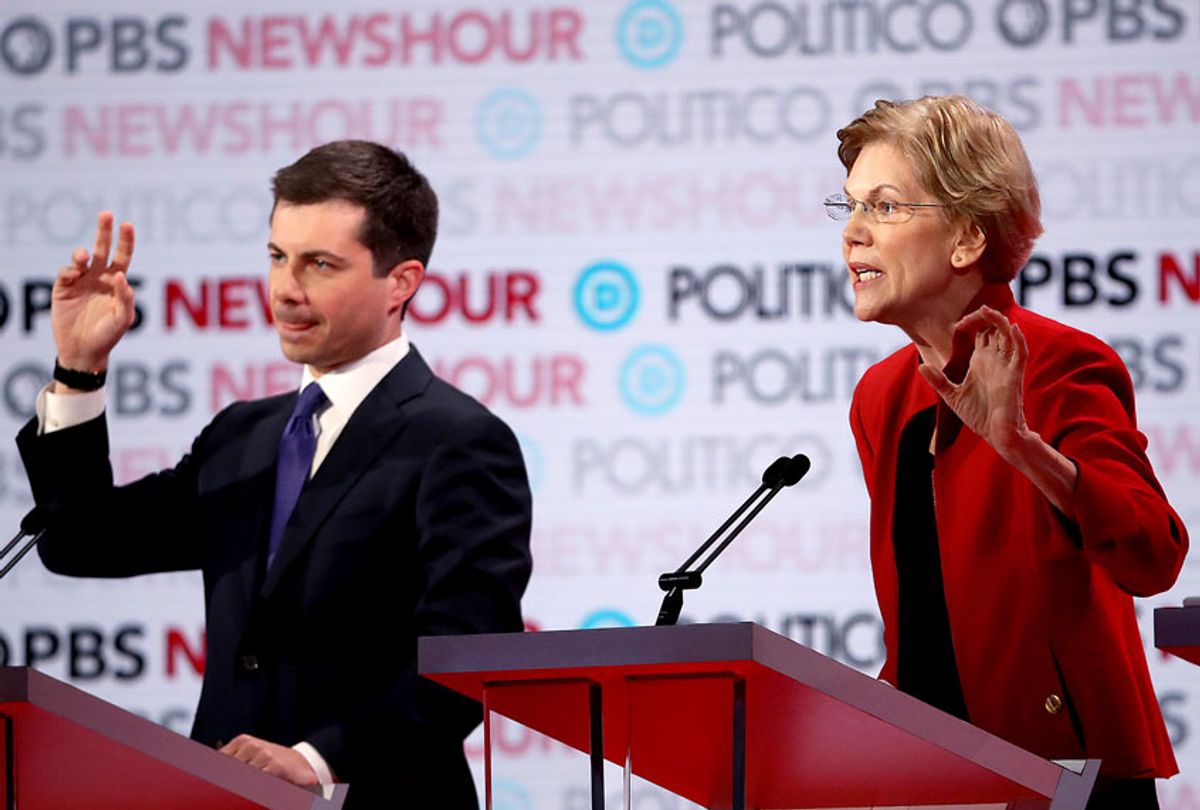 Sen. Elizabeth Warren (D-MA) speaks as South Bend, Indiana Mayor Pete Buttigieg raises his hand during the Democratic presidential primary debate at Loyola Marymount University on December 19, 2019 in Los Angeles, California. Seven candidates out of the crowded field qualified for the 6th and last Democratic presidential primary debate of 2019 hosted by PBS NewsHour and Politico. (Justin Sullivan/Getty Images)
