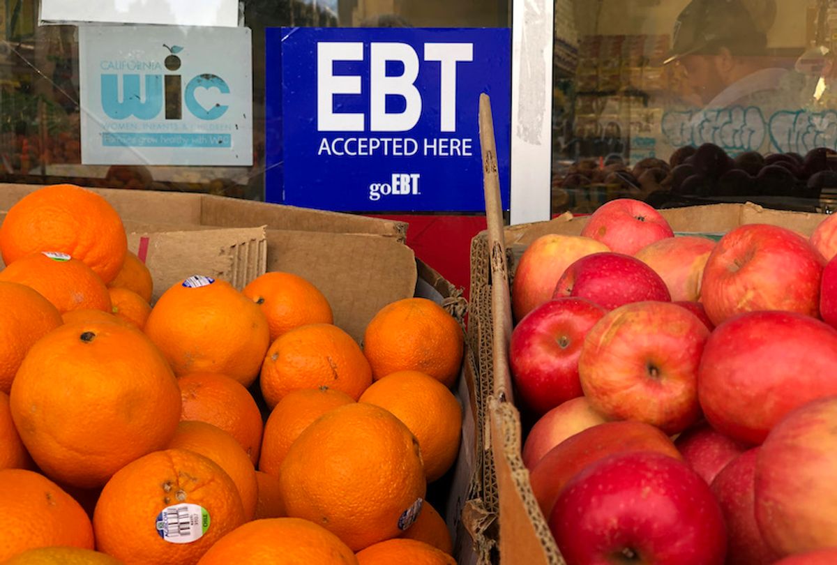 A sign noting the acceptance of electronic benefit transfer (EBT) cards that are used by state welfare departments to issue benefits is displayed at a grocery store on December 04, 2019 in Oakland, California. (Justin Sullivan/Getty Images)