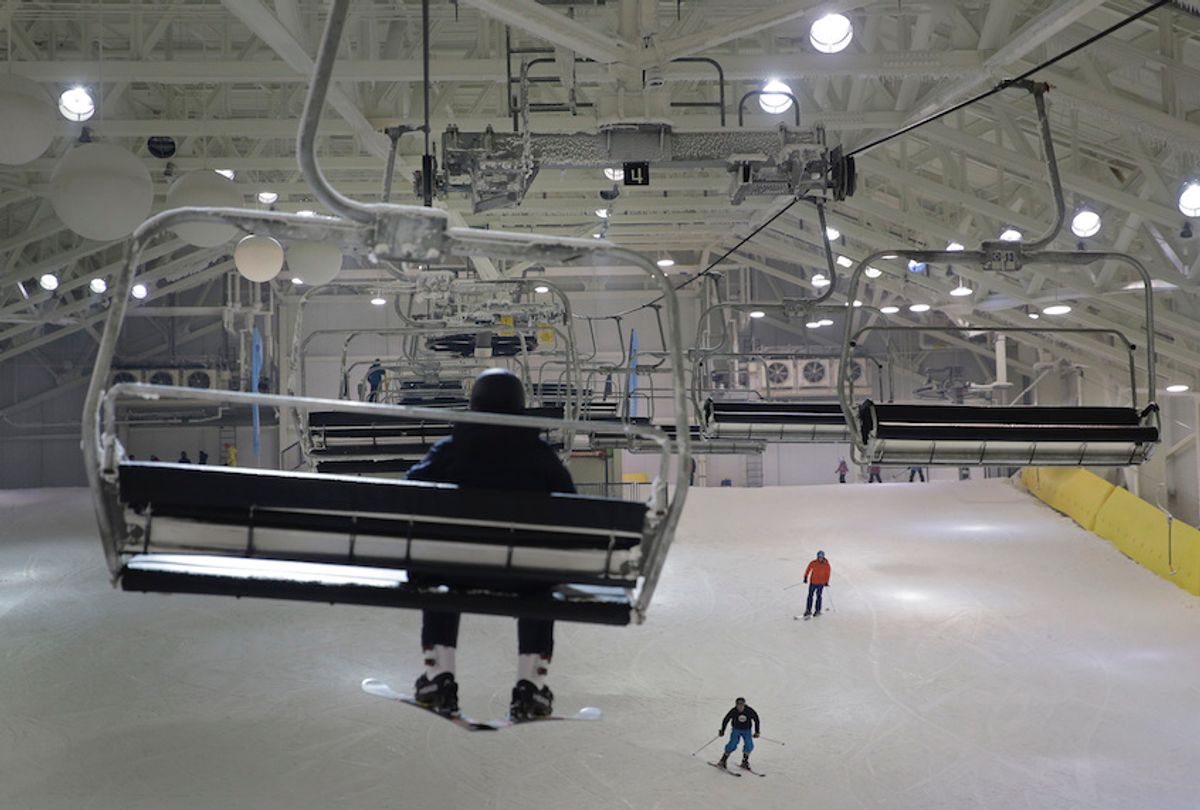 Snowboarders and skiers enjoy the grand opening of Big Snow in East Rutherford, N.J., Thursday, Dec. 5, 2019. The facility, which is part of the American Dream mega-mall, is North America's first indoor ski and snowboard facility with real snow.  (AP Photo/Seth Wenig)