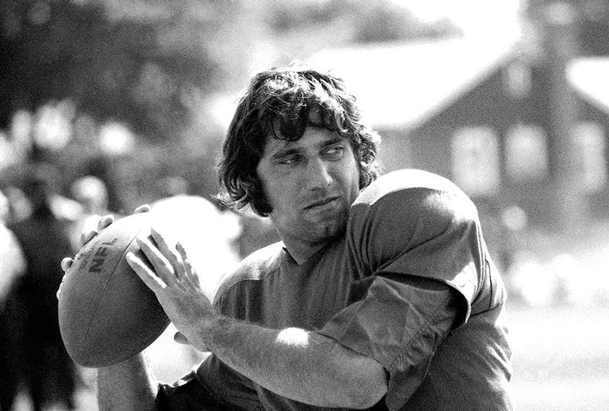 New York Jets' quarterback Joe Namath practices hurling the ball at the team's training camp at Hofstra University on Long Island, Aug. 18, 1970. Earlier Namath said he didn?t think he could play ball this season, blaming both business and physical problems for his statement. Namath checked into the training camp on August 18 after almost two weeks' being listed as AWOL.  (AP Photo/Harry Harris)