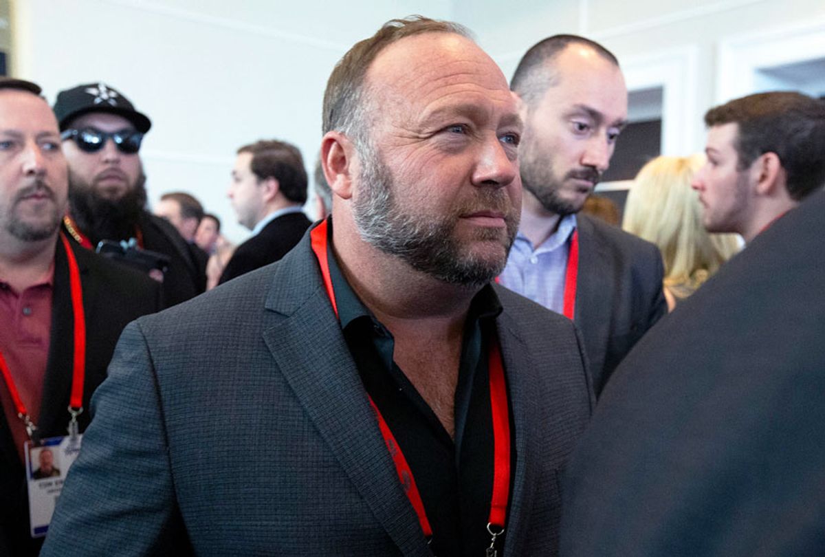 Conspiracy theorist Alex Jones walks at the Conservative Political Action Conference, CPAC 2020, at the National Harbor, in Oxon Hill, Md., Thursday, Feb. 27, 2020.  (AP Photo/Jose Luis Magana)