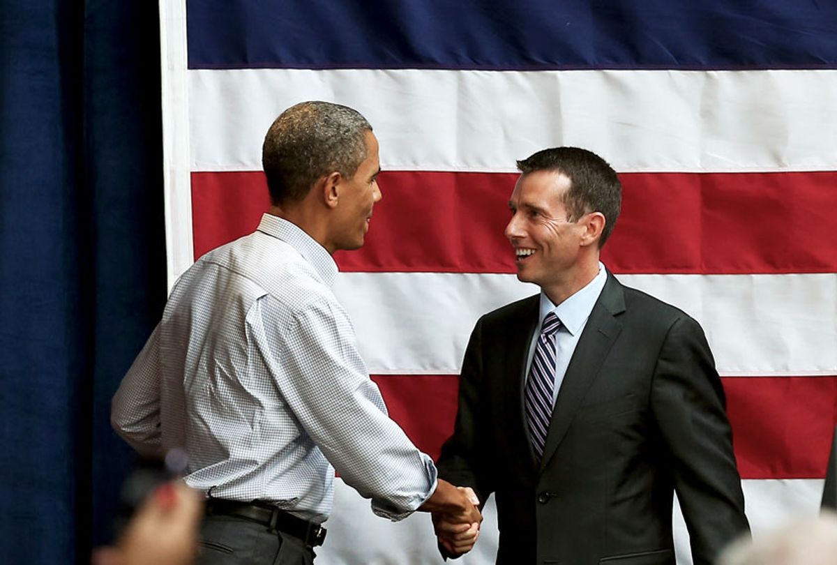 David Plouffe, a senior adviser to U.S. President Barack Obama, is greeted by the president after introducing him at a fundraising reception at the Bridgeport Arts Center on August 12, 2012 in Chicago, Illinois. On Monday Obama will begin a three-day, nine-city campaign trip through Iowa. (Scott Olson/Getty Images)