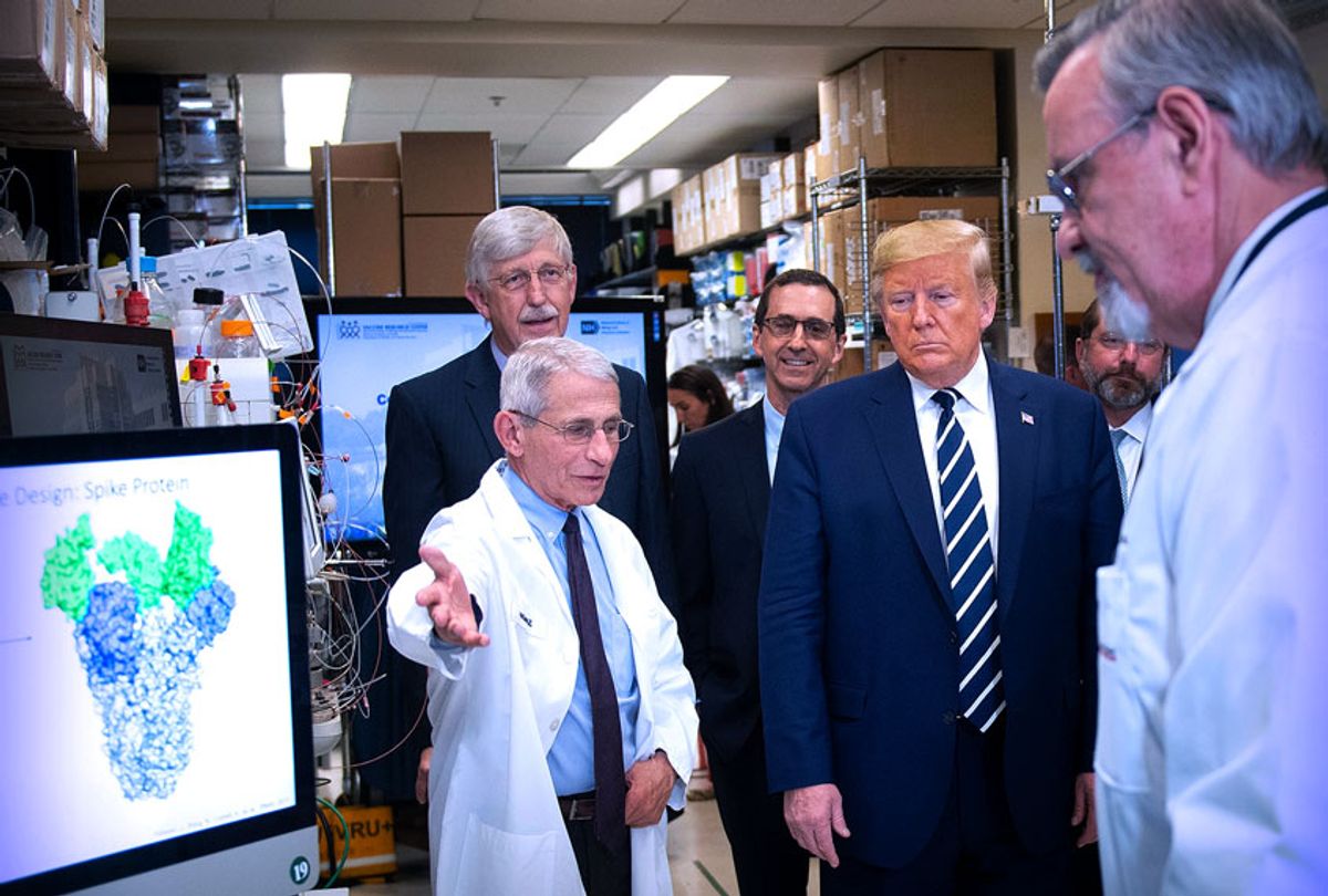 National Institute of Allergy and Infectious Diseases Director Tony Fauci (L) speaks to US President Donald Trump during a tour of the National Institutes of Health's Vaccine Research Center March 3, 2020, in Bethesda, Maryland. - The US Federal Reserve announced an emergency rate cut responding to the growing economic risk posed by the coronavirus epidemic after the UN health agency said the world has entered "uncharted territory" with the outbreak's rapid spread.  (Brendan Smialowski/AFP via Getty Images)