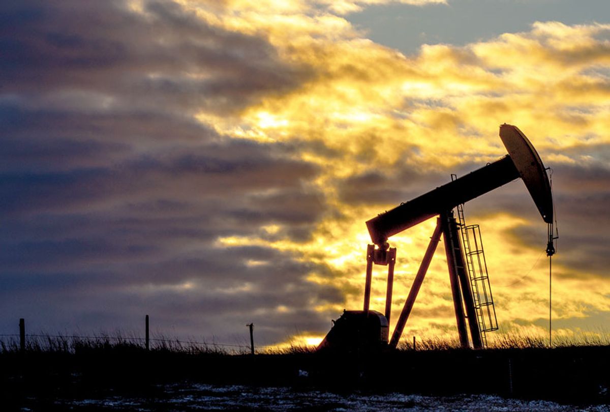 Pumpjack at oil industry against cloudy sky during sunset in North Dakota, USA (Getty Images)