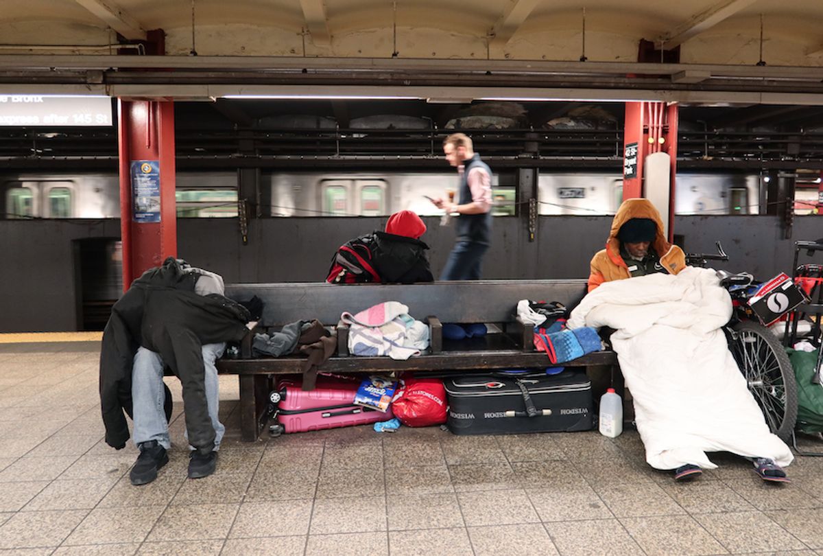 Homeless people sleep in the 42nd St-Bryant Park Subway station on March 9, 2020 in New York City.  (Gary Hershorn/Corbis via Getty Images)