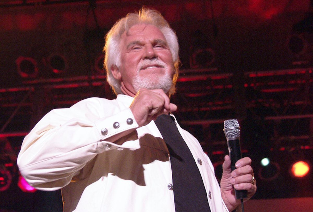 AP File Photo: Kenny Rogers Has Passed Away at 81. AUGUST 14: Kenny Rogers performs at Chastain Park Amphitheatre in Atlanta, Georgia on August 14, 2002.  (AP/ Chris McKay / MediaPunch /IPX)