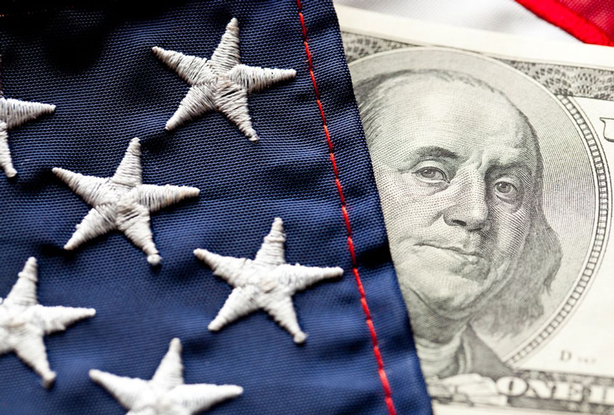 Close-up of Money and U.S. Flag (Getty Images)
