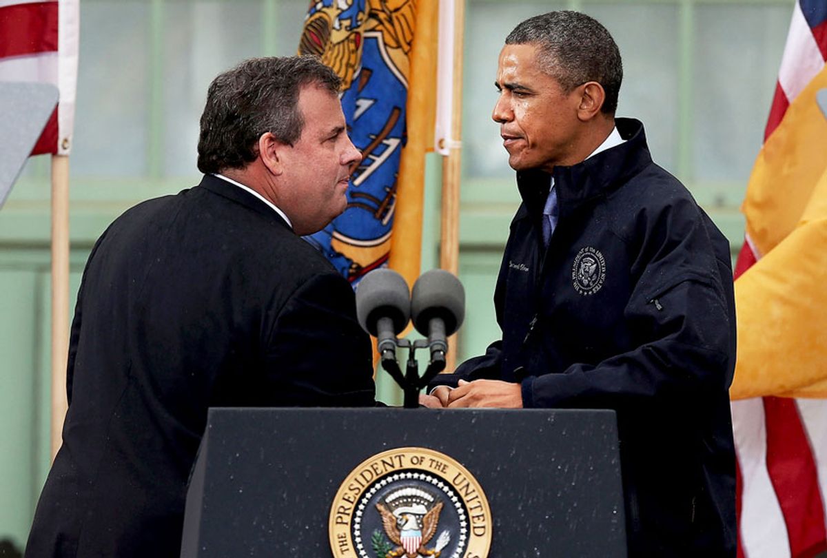 President Barack Obama stands with New Jersey Gov. Chris Christie before speaking to crowds along a rain soaked boardwalk on May 28, 2013 in Asbury Park, New Jersey. Seven months after Superstorm Sandy devastated the region, President Obama declared that the Jersey Shore is back in an appearance with the governor.  (Spencer Platt/Getty Images)