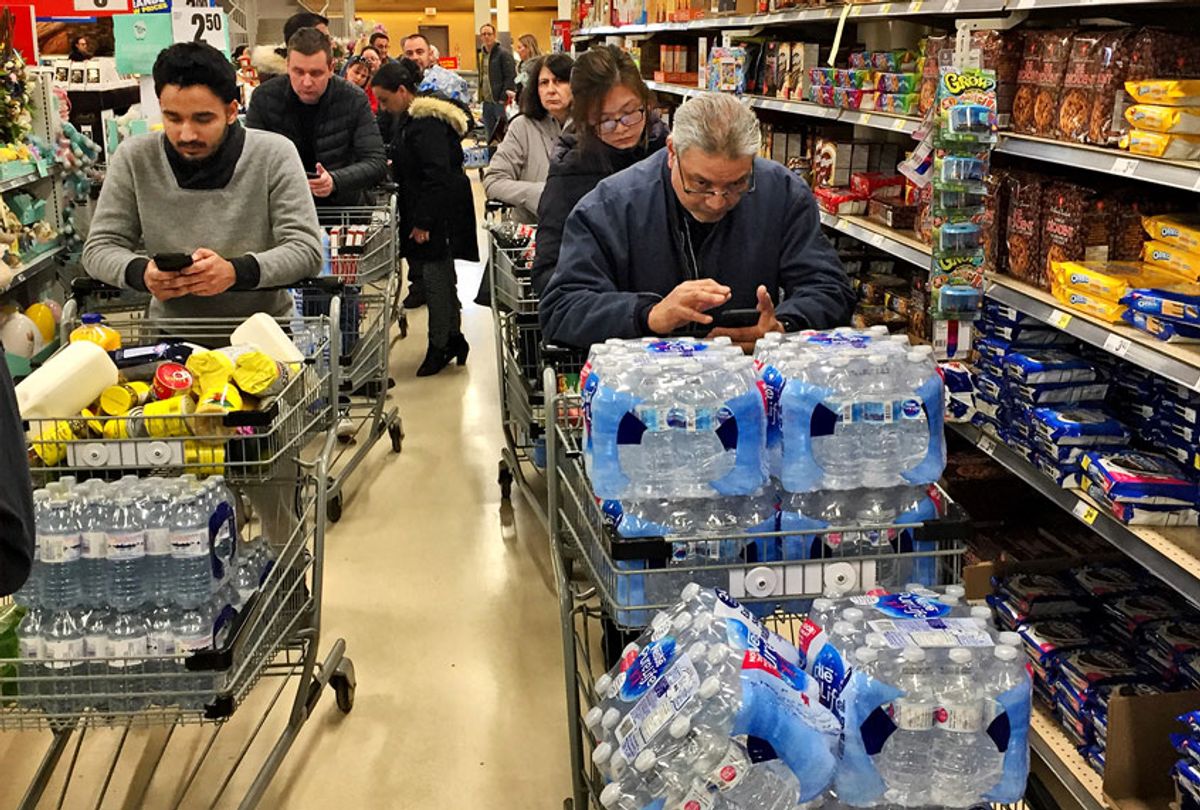 Grocery stores were packed with big crowds and long lines as latest spike of COVID-19 cases prompted panic buying across the country on March 12, 2020 in Toronto, Ontario, Canada. (Creative Touch Imaging Ltd./NurPhoto via Getty Images)