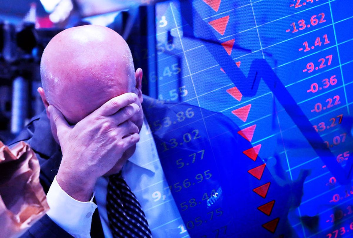 A trader has his head in his hand on the floor of the New York Stock Exchange | Stock market graph (AP Photo/Getty Images/Salon)