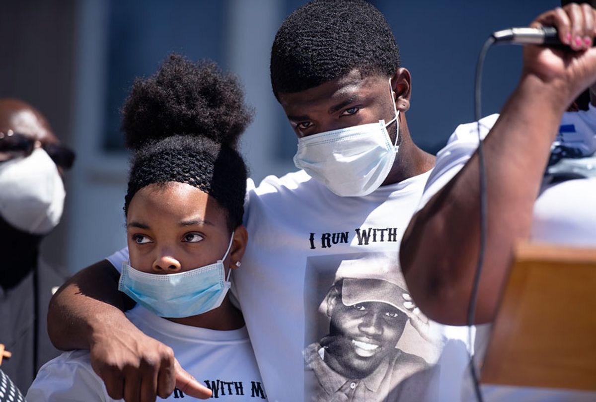 Family of Ahmaud Arbery embrace at the Glynn County Courthouse during a protest of the shooting death of Arbery on May 8, 2020 in Brunswick, Georgia (Sean Rayford/Getty Images)