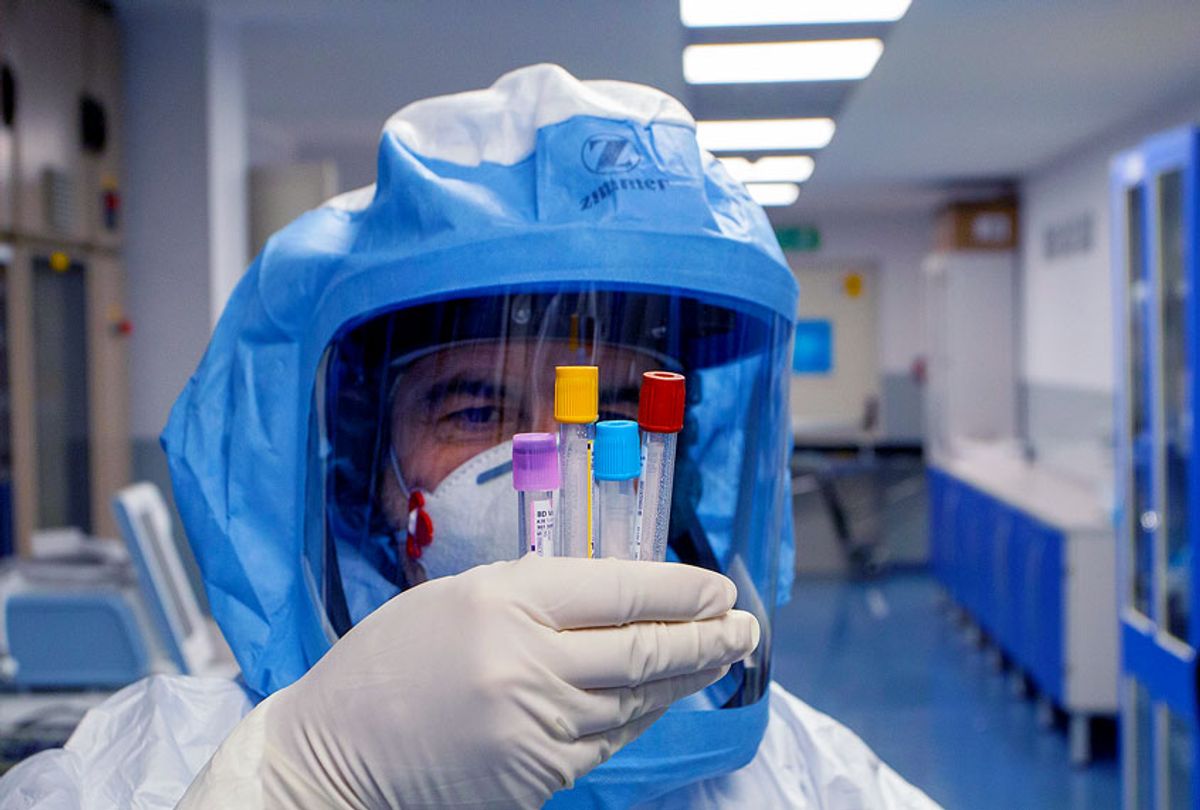A nurse looks at test tubes after taking a blood sample from a patient suffering from Covid 19, in the Covid-19 department at the Bari Polyclinic on May 05, 2020 in Bari, Italy. (Donato Fasano/Getty Images)