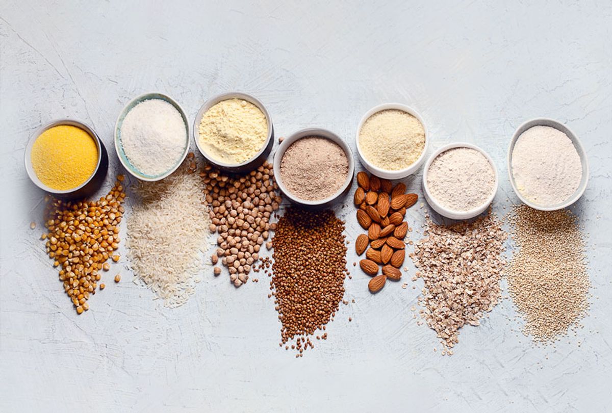 Various flours - chickpeas, rice, buckwheat, quinoa, almond, corn, oatmeal - on a grey background (Getty Images)