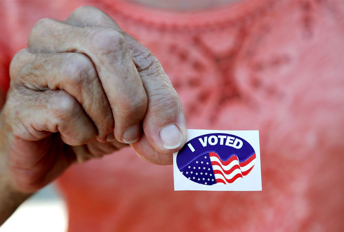 Woman shows her sticker after she voted in the Florida presidential primary in Cape Coral, Fla. (AP Photo/Elise Amendola)