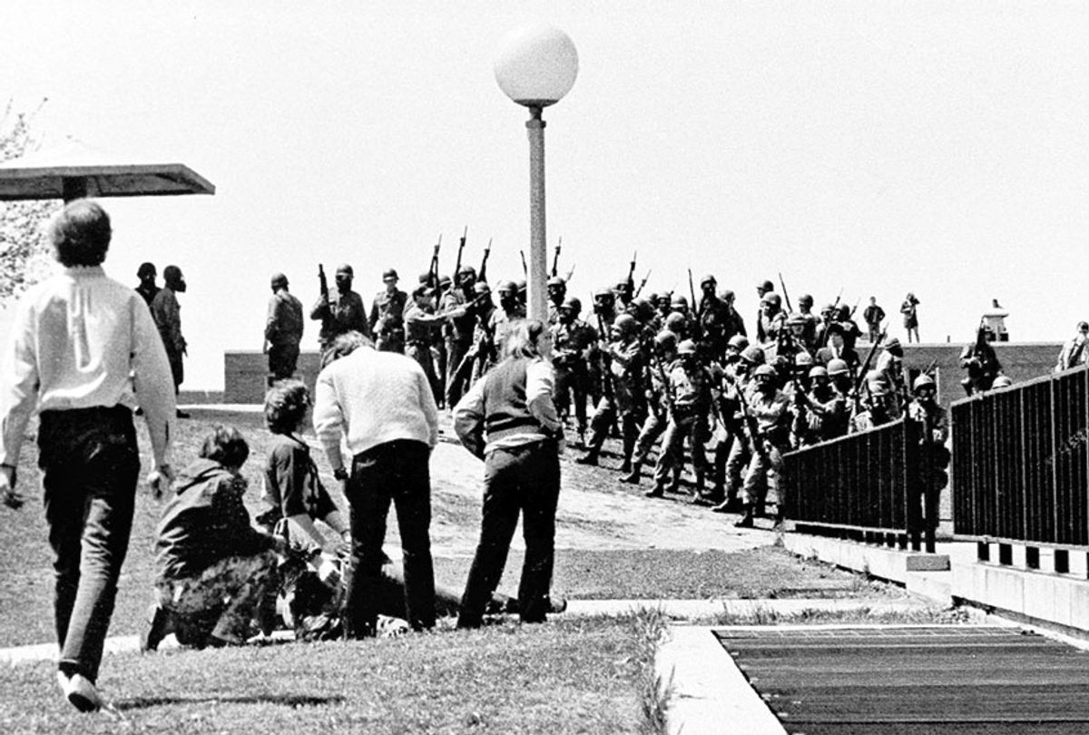 Members of the Ohio National Guard killed four students and injured nine at Kent State University during a campus protest against the Vietnam War.  (AP Photo/Douglas Moore)