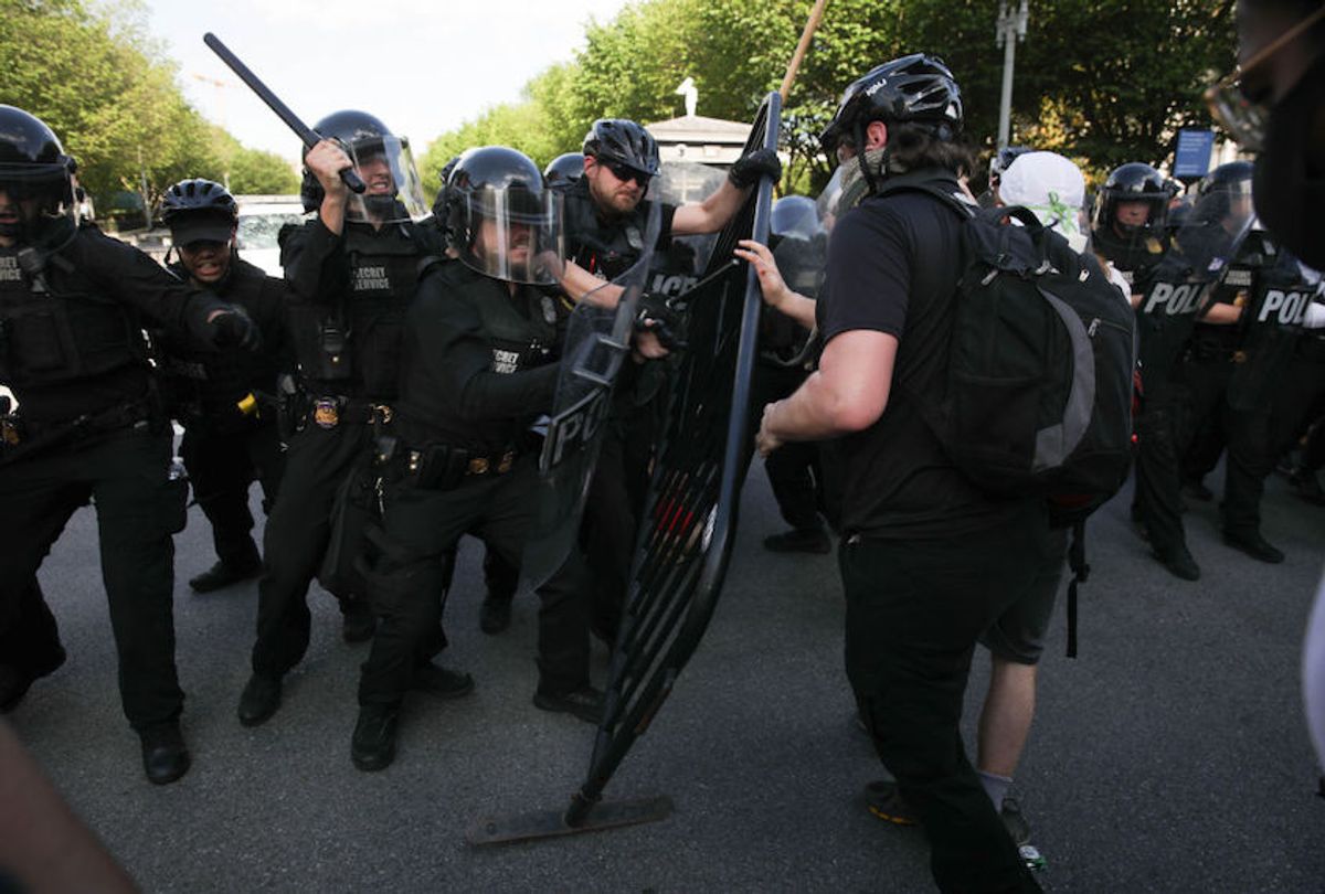 Demonstrators, gathered at Lafayette Park across from the White House, attempt to breach a police barricade during a protest over the death of George Floyd, an unarmed black man who died after being pinned down by a white police officer in Washington, United States on May 30, 2020.
 (Yasin Ozturk/Anadolu Agency via Getty Images)