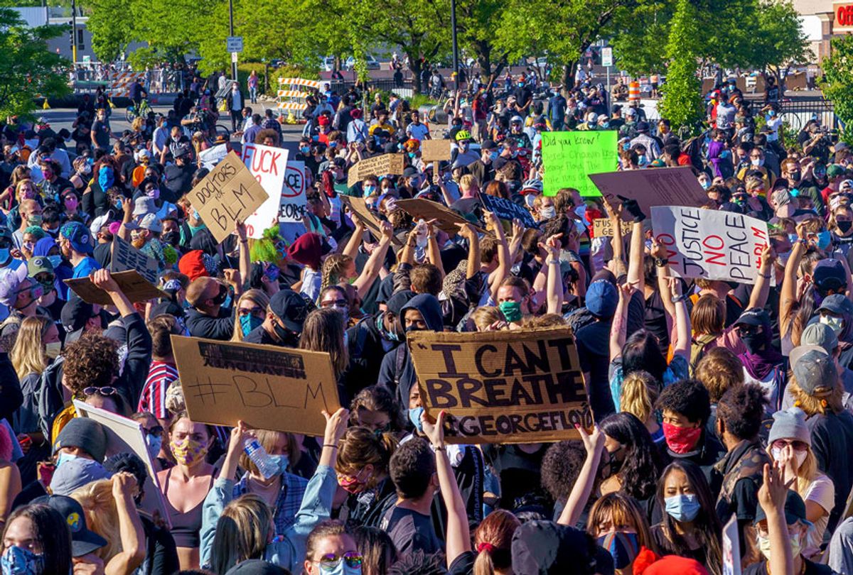 Protesters march during a demonstration in a call for justice for George Floyd who died while in custody of the Minneapolis police, on May 30, 2020 by the 5th police precinct in Minneapolis, Minnesota. (KEREM YUCEL/AFP via Getty Images)