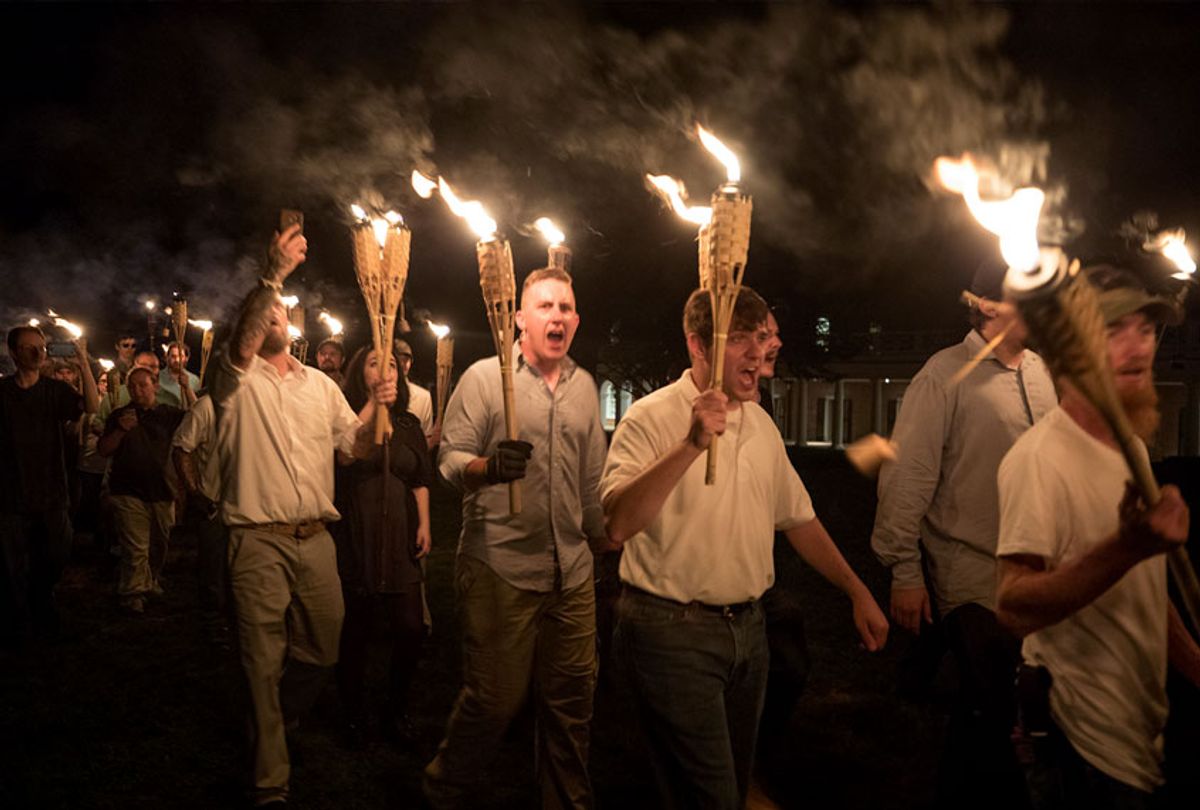 Several hundred white nationalists and white supremacists carrying torches marched in a parade through the University of Virginia campus, chanting "White lives matter! You will not replace us! and Jews will not replace us!" (Evelyn Hockstein/For The Washington Post via Getty Images)