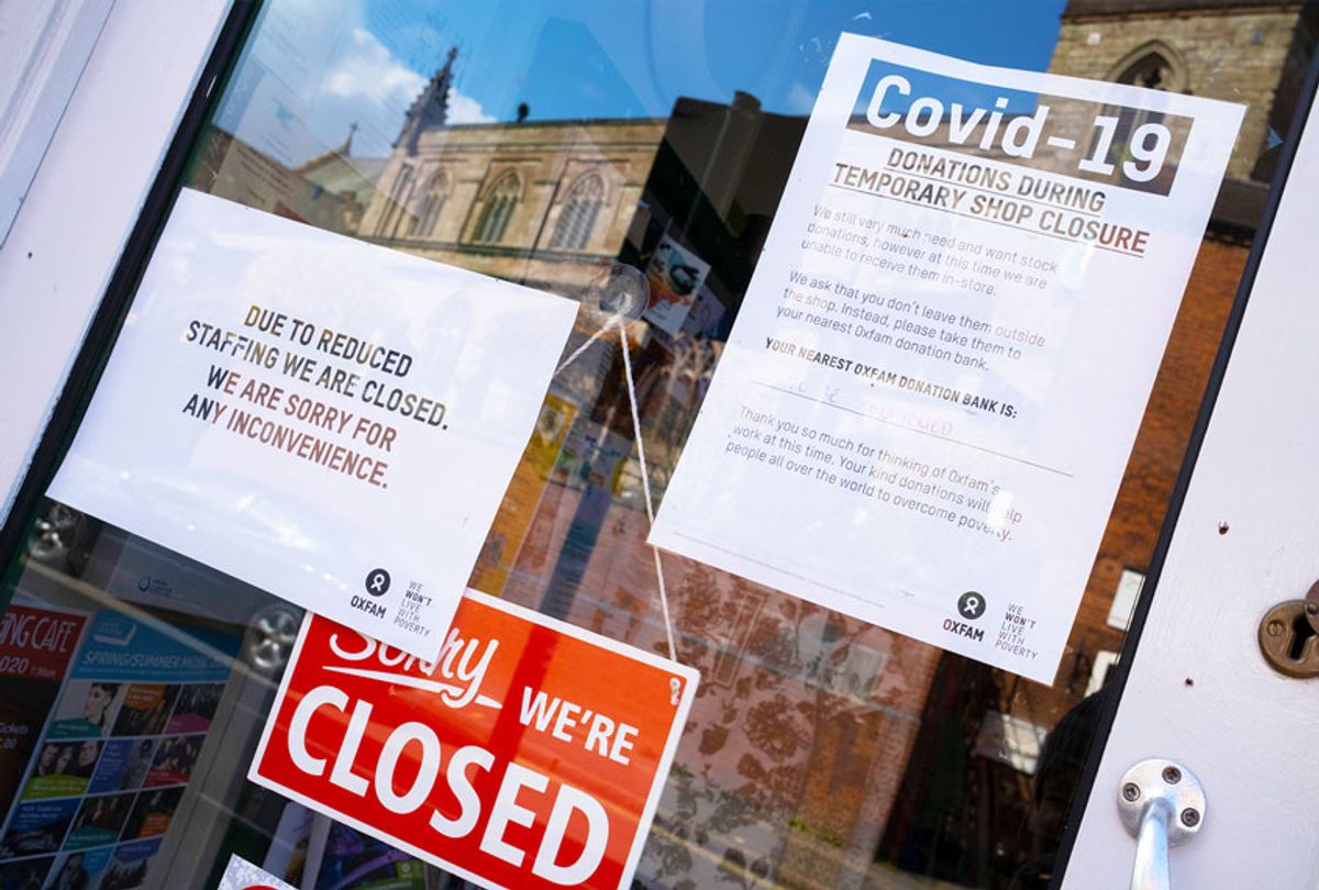 Store closed, with signs about COVID-19 (Mike Kemp/In PIctures via Getty Images)