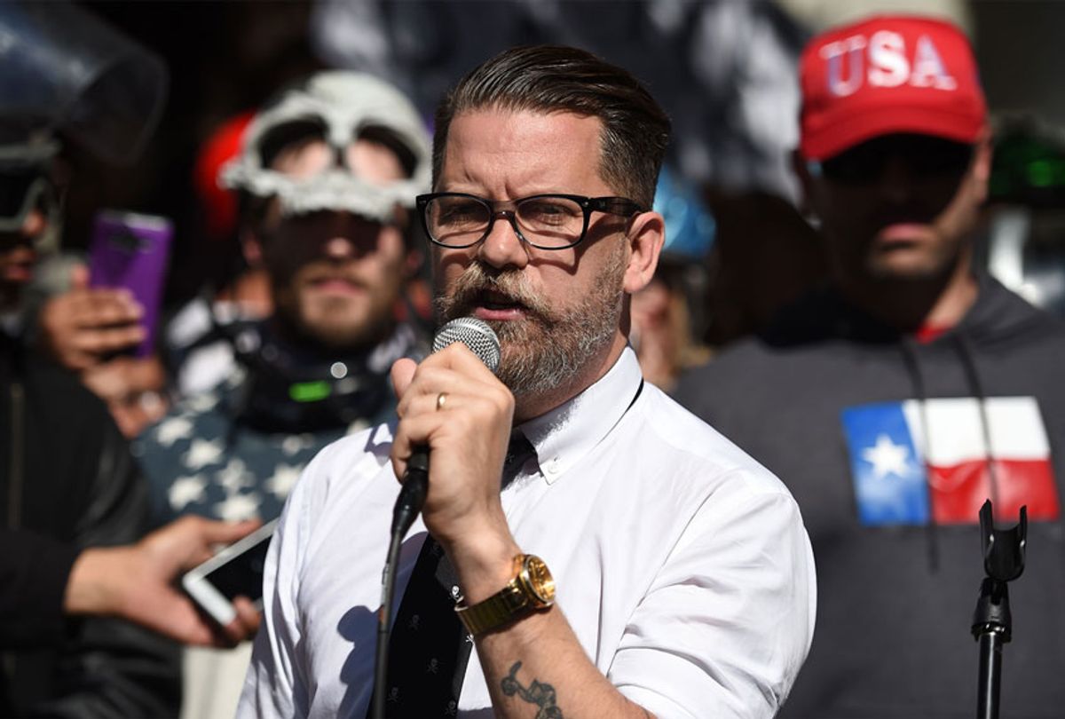 Vice Media co-founder and conservative speaker Gavin McInnes reads a speech written by Ann Coulter to a crowd during a conservative rally in Berkeley, California (JOSH EDELSON/AFP via Getty Image)