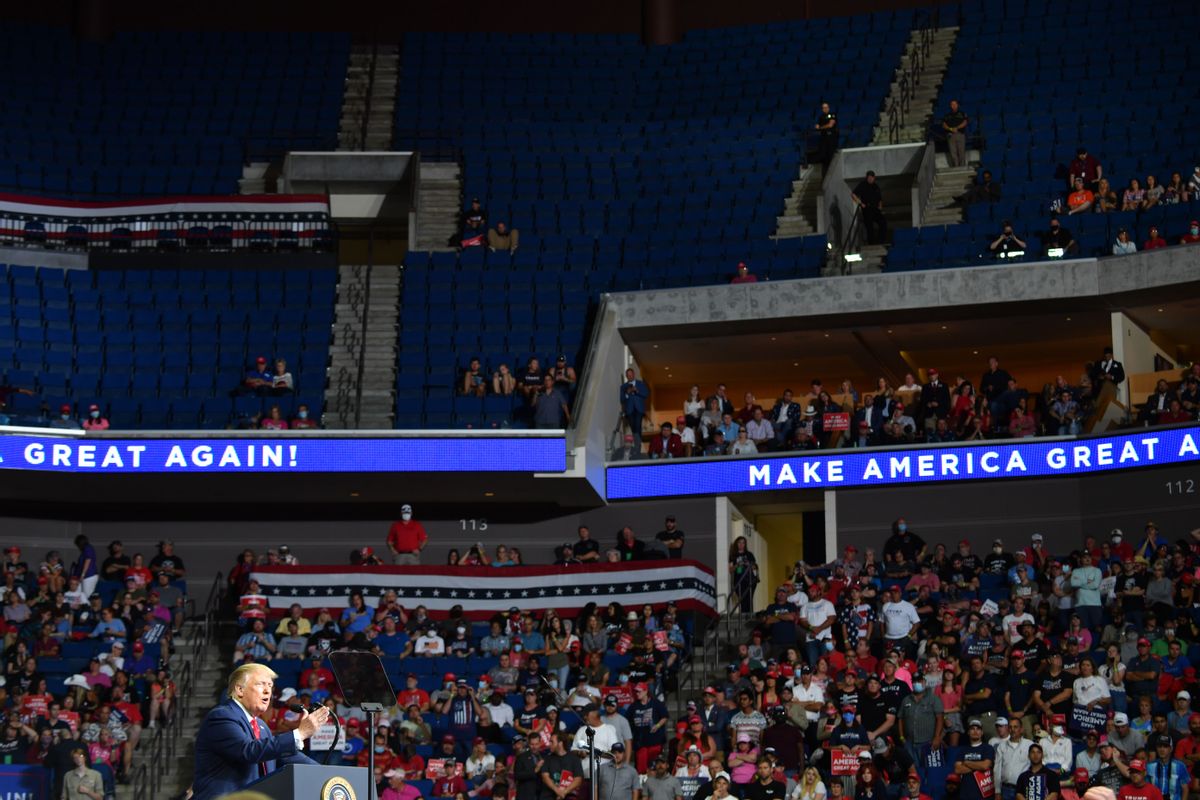 The upper section of the arena is seen partially empty as US President Donald Trump speaks during a campaign rally at the BOK Center on June 20, 2020 in Tulsa, Oklahoma. - Hundreds of supporters lined up early for Donald Trump's first political rally in months, saying the risk of contracting COVID-19 in a big, packed arena would not keep them from hearing the president's campaign message.  (Photo by Nicholas Kamm/AFP via Getty Images)