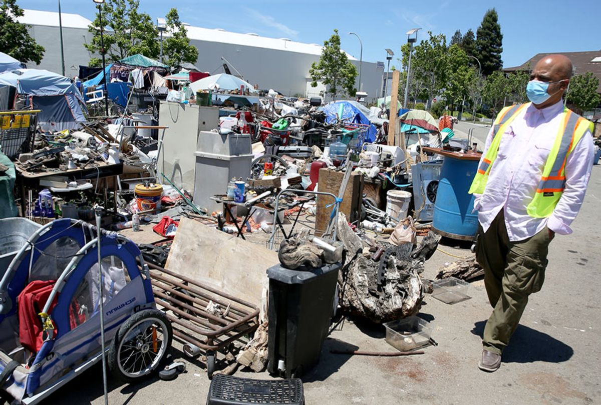 Preston Turner walks through a homeless encampment at Union Point in Oakland, Calif., on Wednesday, May 27, 2020. The city of Oakland is trying to get coronavirus testing for homeless people. (Jane Tyska/Digital First Media/East Bay Times via Getty Images)