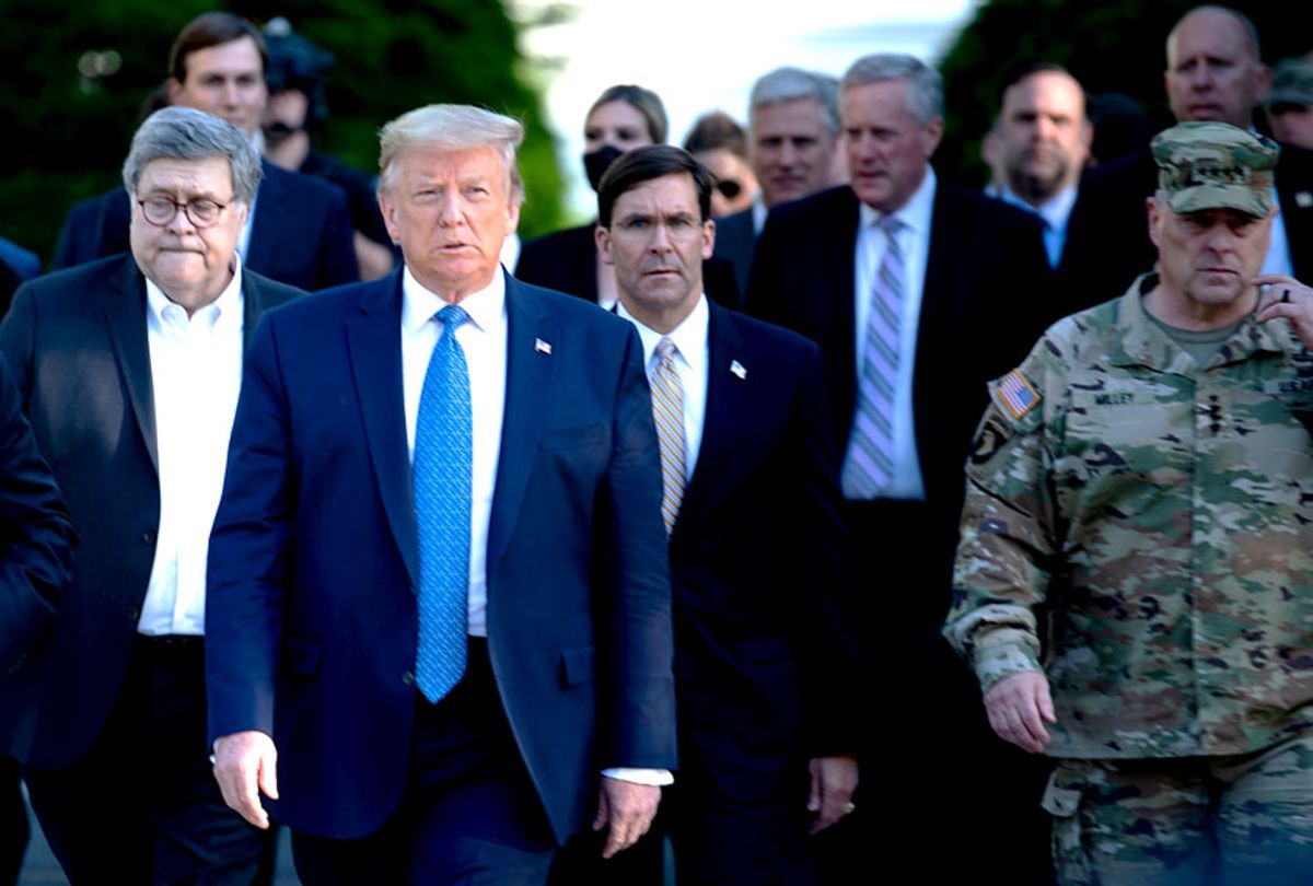 US President Donald Trump walks with US Attorney General William Barr (L), US Secretary of Defense Mark T. Esper (C), Chairman of the Joint Chiefs of Staff Mark A. Milley (R), and others from the White House to visit St. John's Church after the area was cleared of people protesting the death of George Floyd June 1, 2020, in Washington, DC (Getty Images)