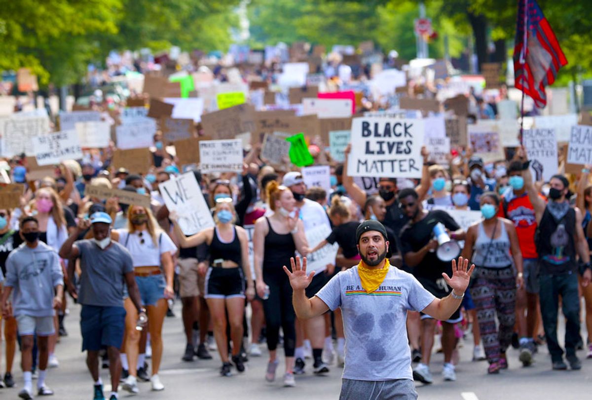 Demonstrators march to protest against police brutality and the death of George Floyd, in Virginia (Win McNamee/Getty Images)