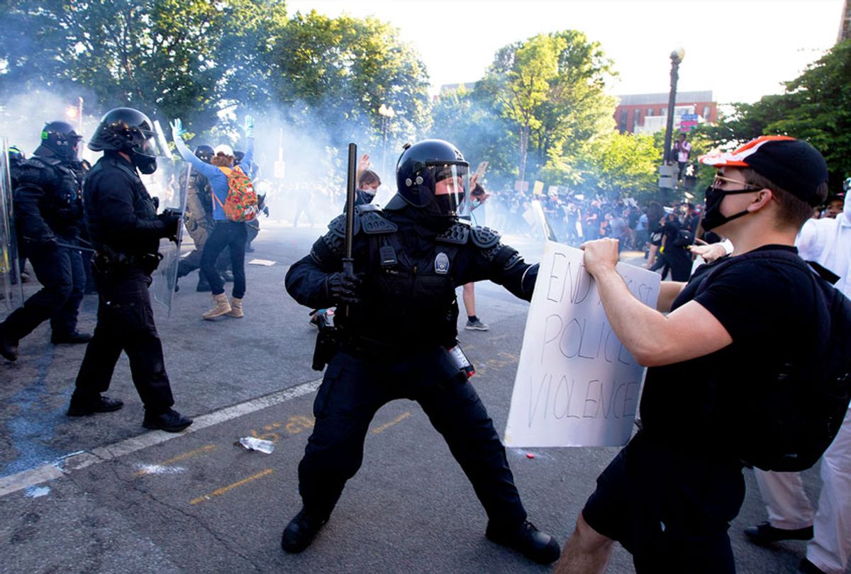 Police officers clash with protestors near the White House on June 1, 2020 as demonstrations against George Floyd's death continue. - Police fired tear gas outside the White House late Sunday as anti-racism protestors again took to the streets to voice fury at police brutality. (Getty Images)